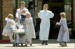 Polygamy isn't all sister wives and fun. A woman in Hilldale, Utah, where polygamy is ubiquitous, exits a store with several children. Image of Polygamy isn't all sister wives and fun. A woman in Hilldale, Utah, where polygamy is ubiquitous, exits a store with several children.