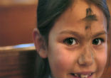 Young boy praying on Ash Wednesday. Image of Young boy praying on Ash Wednesday.