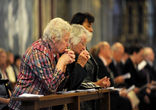 Praying during Mass. Image of Praying during Mass.