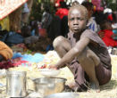 The South Sudanese girl eats her meager ration. Many of South Sudan's 3.7 million people are entirely reliant on external aid for survival. Image of The South Sudanese girl eats her meager ration. Many of South Sudan's 3.7 million people are entirely reliant on external aid for survival.
