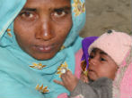 Bought and sold, this woman and her child have a bleak future. And nobody is coming to the rescue. Image of Bought and sold, this woman and her child have a bleak future. And nobody is coming to the rescue.