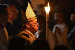 Pope Francis enters with his candle symbolizing the light of Christ. Image of Pope Francis enters with his candle symbolizing the light of Christ.