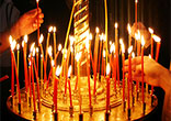 Lighting a candle is a way of extending one's prayer and showing solidarity with the person on whose behalf the prayer is offered. Image of Lighting a candle is a way of extending one's prayer and showing solidarity with the person on whose behalf the prayer is offered.
