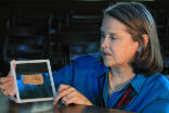 Professor Karen King with the controversial papyrus scrap. The scrap is authentic, but its words are very likely fiction. Image of Professor Karen King with the controversial papyrus scrap. The scrap is authentic, but its words are very likely fiction.