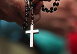 Praying the rosary deepens our faith, and strengthens us agains evil. Image of Praying the rosary deepens our faith, and strengthens us agains evil.