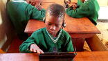 Kids enjoy using tablet computers for learning and are greatly enriched by its expanded capabilities. Image of Kids enjoy using tablet computers for learning and are greatly enriched by its expanded capabilities.