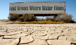 A sign intended to build public support for water rights for farmers now has a new significance. Image of A sign intended to build public support for water rights for farmers now has a new significance.