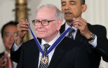 Obama awarding Buffett the Presidential Medal of Freedom. Image of Obama awarding Buffett the Presidential Medal of Freedom.