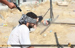 A victim of ISIS kneels for a photograph and waits for the bullet that will end his life. Image of A victim of ISIS kneels for a photograph and waits for the bullet that will end his life.