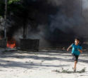 A child flees violence in Syria. In that country's civil war, children are considered viable targets. Image of A child flees violence in Syria. In that country's civil war, children are considered viable targets.