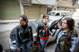 Human rights observers have reported that three Kurdish women were beheaded by the Islamic State for fighting to defend their village. Image of Human rights observers have reported that three Kurdish women were beheaded by the Islamic State for fighting to defend their village.