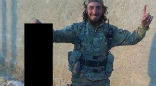 An Islamic State terrorist shared this image of himself posing with the severed head of a female Kurdish fighter. Image of An Islamic State terrorist shared this image of himself posing with the severed head of a female Kurdish fighter.