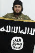 Mounir Raad poses with the flag of the Islamic State. He tweeted a chilling picture of children armed with AK-47 assault rifles. Image of Mounir Raad poses with the flag of the Islamic State. He tweeted a chilling picture of children armed with AK-47 assault rifles.