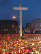 A Christian cross and candles are seen on Pilsudski square in Poland to remember and honor the death of Polish leaders in 2010. Image of A Christian cross and candles are seen on Pilsudski square in Poland to remember and honor the death of Polish leaders in 2010.