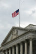 The White House lowers its flags to commemorate the Chattanooga shooting victims. Image of The White House lowers its flags to commemorate the Chattanooga shooting victims.
