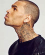 Chris Brown performing onstage Image of Chris Brown performing onstage