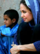 Angelina Jolie spending time with the children in one of her humanitarian missions. Image of Angelina Jolie spending time with the children in one of her humanitarian missions.