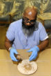 An inmate proudly shares the seal made for Pope Francis' seat. Image of An inmate proudly shares the seal made for Pope Francis' seat.