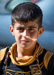 ISIS forces many young boys to become militants, often threatening their families. Image of ISIS forces many young boys to become militants, often threatening their families.
