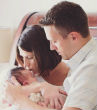 Baby Abigail photographed with her parents. Image of Baby Abigail photographed with her parents.