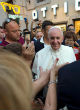 Pope Francis was mobbed after appearing outside a prescription glasses store in Rome last week. Image of Pope Francis was mobbed after appearing outside a prescription glasses store in Rome last week.