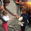 German child gives a refugee candy. Image of German child gives a refugee candy.