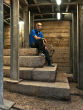 Dr. Joe Uziel sits atop the staircase.
Image of Dr. Joe Uziel sits atop the staircase.