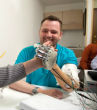 Man feels through the use of prosthetic hands. Image of Man feels through the use of prosthetic hands.