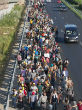 Massive amounts of migrants begin making journey on foot. Image of Massive amounts of migrants begin making journey on foot.