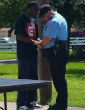 Amey and Chapa pray (Texas City Police Department Facebook). Image of Amey and Chapa pray (Texas City Police Department Facebook).