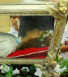 St. Maria Goretti's remains are encased inside a glass-sided casket. Inside the casket is a wax statue, which contains her skeletal remains. None of the sacred remains are visible. Nevertheless, the skeleton is complete, with the exception of small fragments that were taken to be placed in altars and for use in the Church's ministry (mariagorettichicago.com). Image of St. Maria Goretti's remains are encased inside a glass-sided casket. Inside the casket is a wax statue, which contains her skeletal remains. None of the sacred remains are visible. Nevertheless, the skeleton is complete, with the exception of small fragments that were taken to be placed in altars and for use in the Church's ministry (mariagorettichicago.com).
