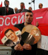 Syrians rally in favor of Assad and Putin. Image of Syrians rally in favor of Assad and Putin.