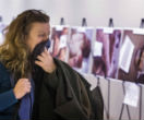 A woman covers her mouth as she views shocking images smuggled out of Syria on display at the UN headquarters in New York (Reuters). Image of A woman covers her mouth as she views shocking images smuggled out of Syria on display at the UN headquarters in New York (Reuters).