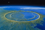 An artist's depiction of the Chicxulub crater, which is the site of the impact that wiped out the dinosaurs. Image of An artist's depiction of the Chicxulub crater, which is the site of the impact that wiped out the dinosaurs.