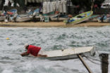 A fisherman checks his boat ahead of the arrival of Patricia. Image of A fisherman checks his boat ahead of the arrival of Patricia.