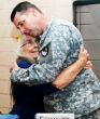 Elizabeth Laird offers hugs to soldiers preparing to deploy (NBC). Image of Elizabeth Laird offers hugs to soldiers preparing to deploy (NBC).