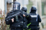 Heavily armed police respond to a terror attack at a concert hall and await the word to go in. Image of Heavily armed police respond to a terror attack at a concert hall and await the word to go in.