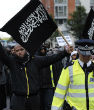 London police escort a Muslim protester. There are some areas in London they fear to tread because of the extreme threat of Islamic terrorism. Image of London police escort a Muslim protester. There are some areas in London they fear to tread because of the extreme threat of Islamic terrorism.