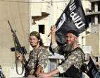 An ISIS terrorist with his finger on the trigger, appears to be armed with a new American-made rifle. U.S. weapons feature prominently with ISIS terrorists, as well as other supplies. Image of An ISIS terrorist with his finger on the trigger, appears to be armed with a new American-made rifle. U.S. weapons feature prominently with ISIS terrorists, as well as other supplies.