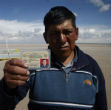 A fisherman displays his license. Without any water or fish, his livelihood has evaporated. Bolivia has declared a national disaster. Image of A fisherman displays his license. Without any water or fish, his livelihood has evaporated. Bolivia has declared a national disaster.