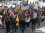 Protesters challenge a federal court order that two men who already served time in jail for arson and released, should return to prison to serve the balance of a 5-year sentence. Image of Protesters challenge a federal court order that two men who already served time in jail for arson and released, should return to prison to serve the balance of a 5-year sentence.