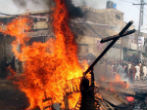 A cross is burned in Pakistan during a spate of violence against Christians there. Image of A cross is burned in Pakistan during a spate of violence against Christians there.