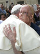 A terminally ill woman meets Pope Francis with an emotional embrace (L'Osservatore Romano/CNS). Image of A terminally ill woman meets Pope Francis with an emotional embrace (L'Osservatore Romano/CNS).