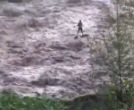 A fisherman is stranded during a flash flood. Image of A fisherman is stranded during a flash flood.