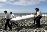 Investigators remove the part from Tanzania. Image of Investigators remove the part from Tanzania.