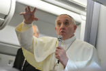 Pope Francis takes questions from reporters on his flight home to Rome. Image of Pope Francis takes questions from reporters on his flight home to Rome.