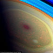 Saturn has a violent storm swirling at the north pole. Image of Saturn has a violent storm swirling at the north pole.