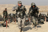 U.S. soldiers providing training to Afghani personnel. Image of U.S. soldiers providing training to Afghani personnel.