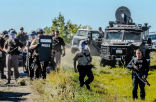 Heavily armed police prepare to move in against protestors in North Dakota. Image of Heavily armed police prepare to move in against protestors in North Dakota.