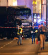 Police are looking for the driver of a big rig truck that plowed into a crowded Christmas market. Image of Police are looking for the driver of a big rig truck that plowed into a crowded Christmas market.